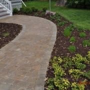 A stamped concrete walkway leading up to the front entrance of a Rockford home.