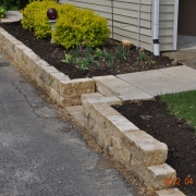 Small retaining walls like this one help to create raised landscaping features.