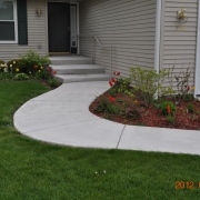 Poured concrete features like this walkway are also a great choice